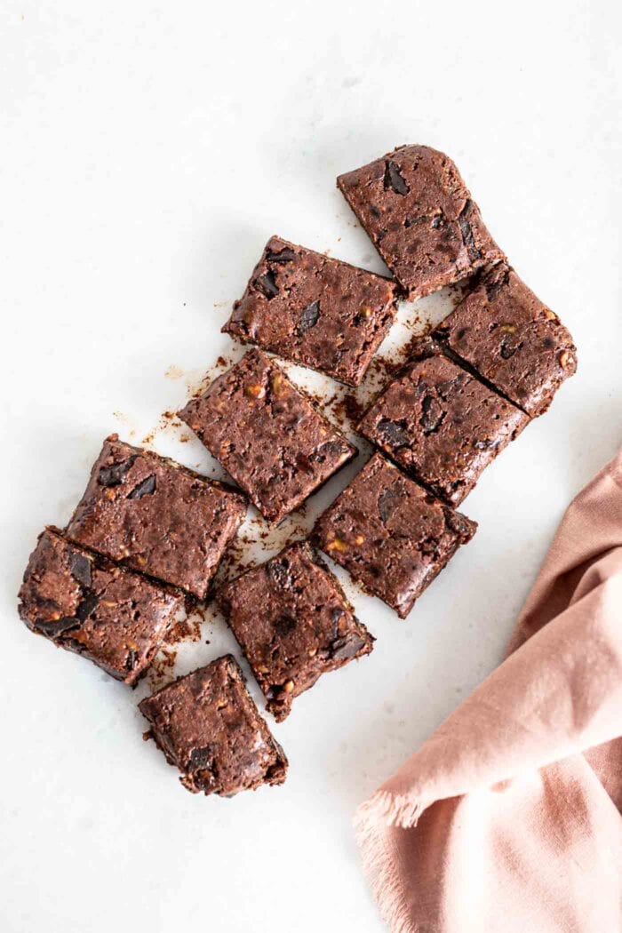 An overhead image of a slab of brownies sliced into 8 pieces.