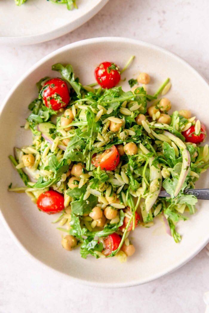Plate or orzo pesto pasta with chickpeas, tomato, red onion and arugula.Plate or orzo pesto pasta with chickpeas, tomato, red onion and arugula.Plate or orzo pesto pasta with chickpeas, tomato, red onion and arugula.Plate or orzo pesto pasta with chickpeas, tomato, red onion and arugula.Plate or orzo pesto pasta with chickpeas, tomato, red onion and arugula.Plate or orzo pesto pasta with chickpeas, tomato, red onion and arugula.