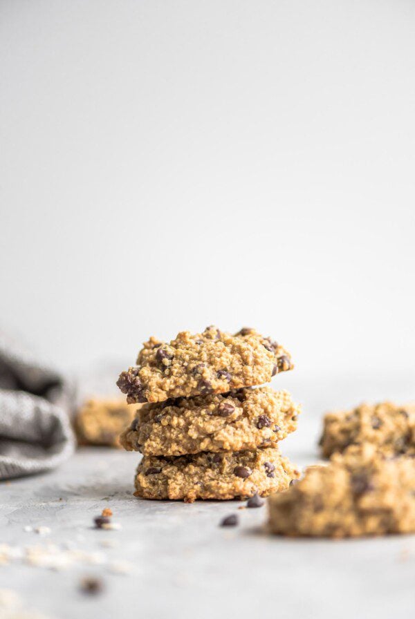 Three chocolate chip cookies stacked on top of each other.