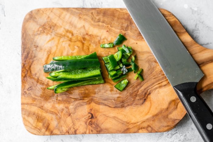 Diced jalapeno on a chopping board.