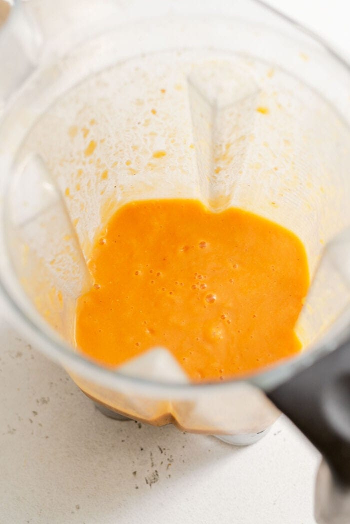 Blended butternut squash lentil soup in a Vitamix container.