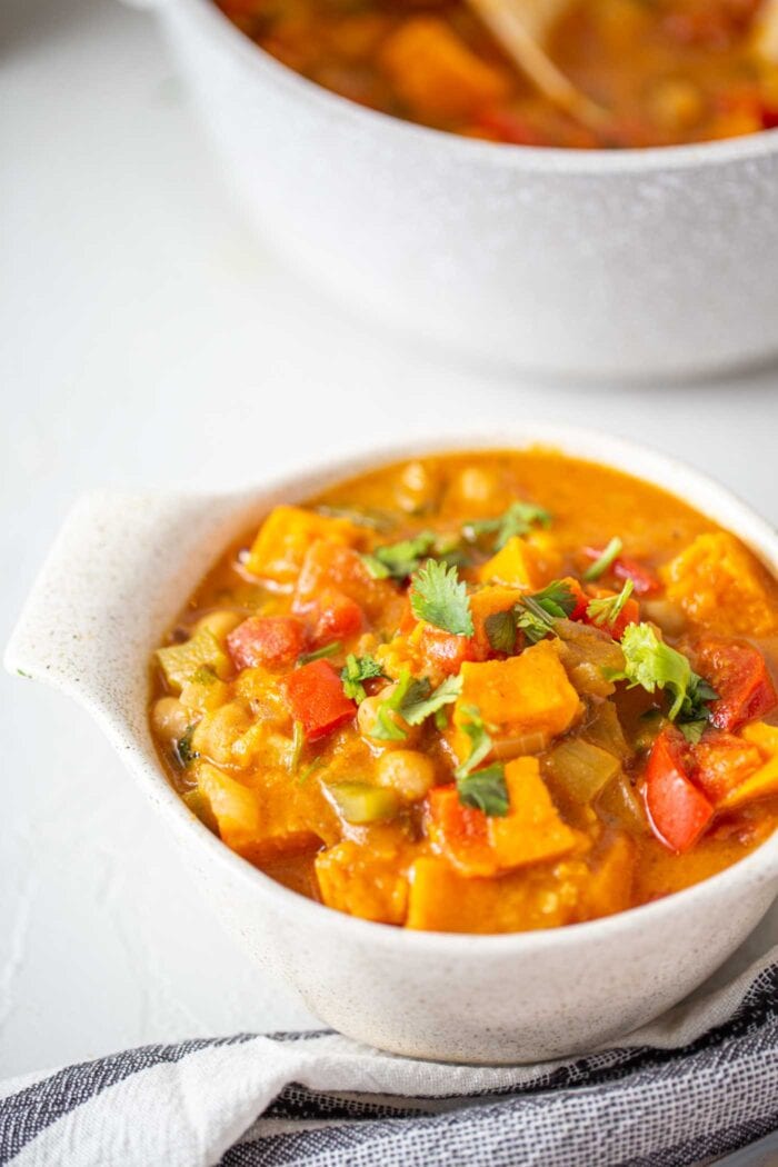 A bowl of sweet potato stew topped with cilantro.