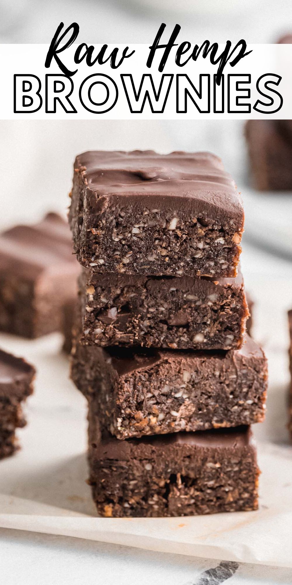Stack of vegan raw brownies with some text reading "raw hemp brownies".