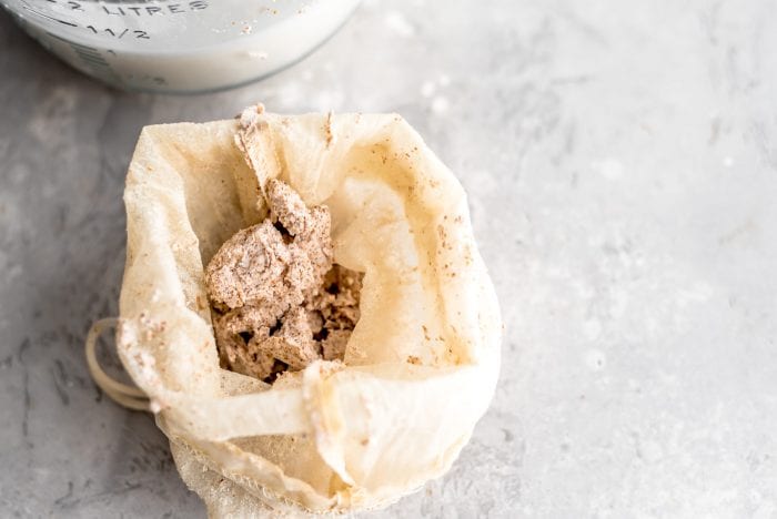 Leftover almond pulp from making almond milk in a nut milk bag.