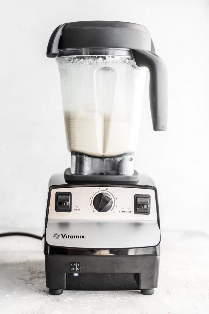 Blended oat milk in a Vitamix ready for straining.