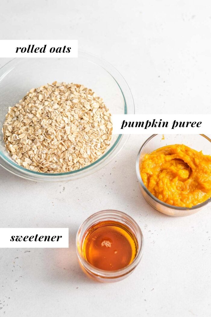 Pumpkin, oats and maple syrup in containers.