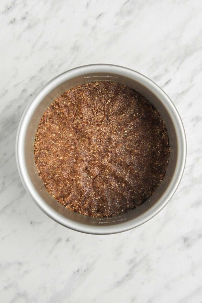 Pie crust pressed into a springform pan.