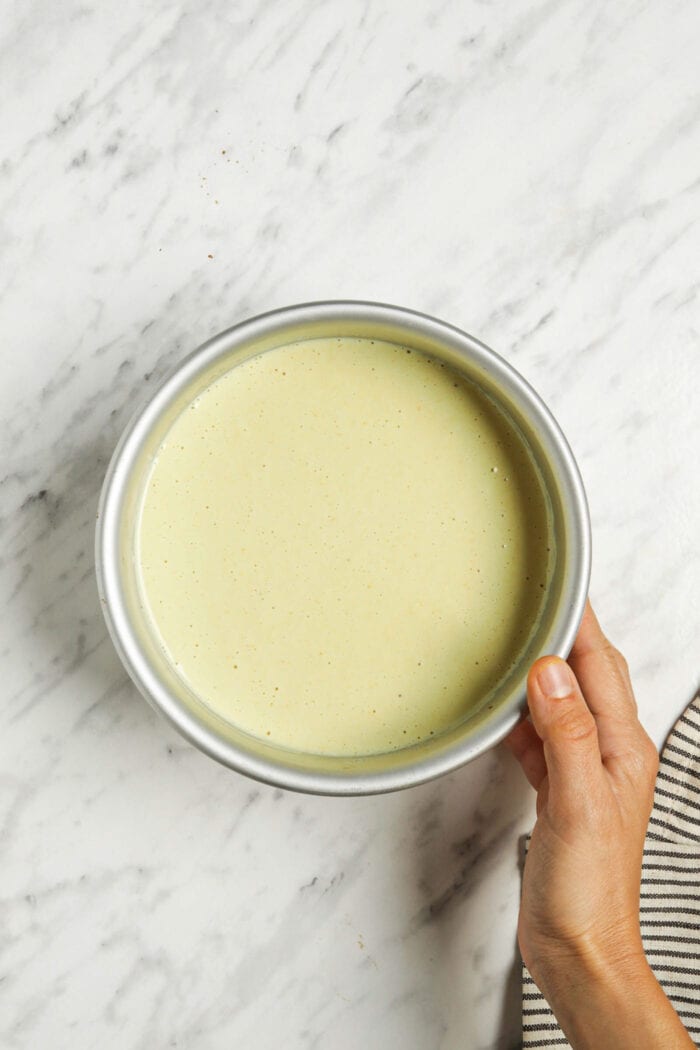 Raw lemon cheesecake in a springform pan.