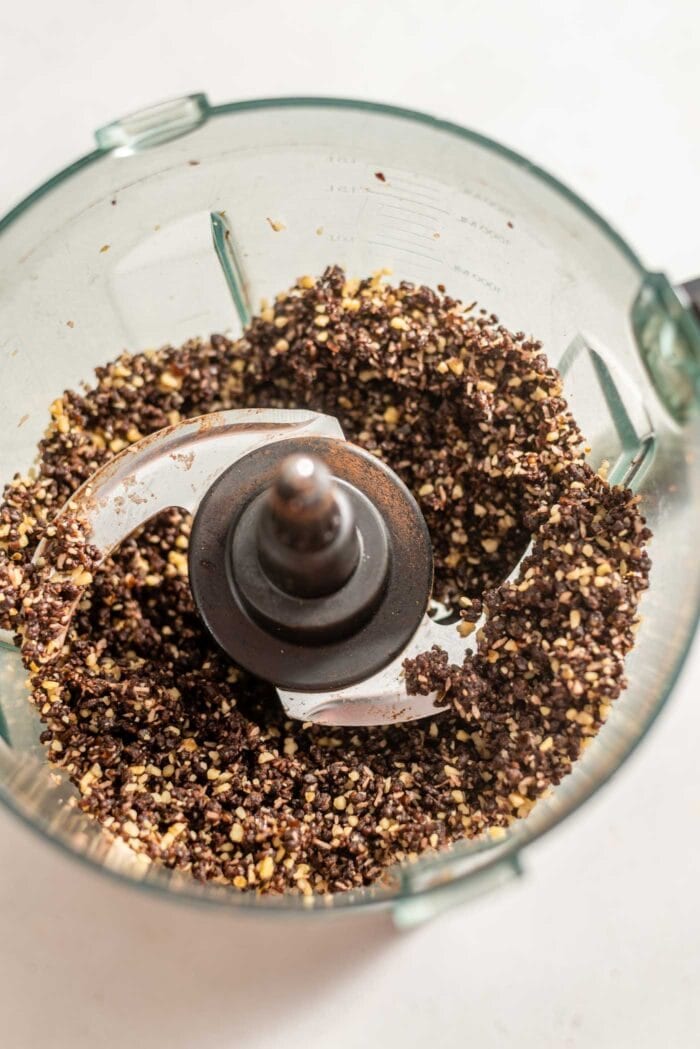 Blended chocolate crust dough in a food processor.