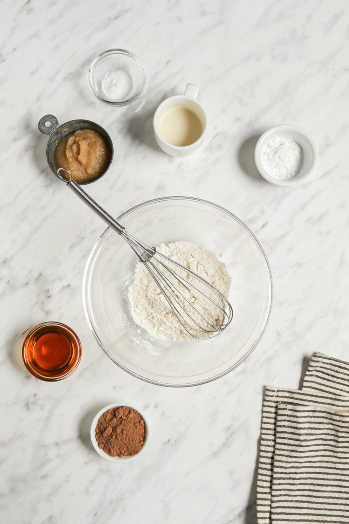 Dry baking ingredients mixed together in a glass mixing bowl.