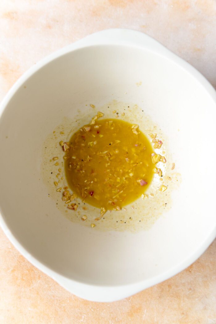 A shallot dijon salad dressing in a large bowl.