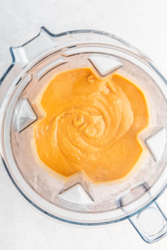 Blended potato corn soup in a blender container.